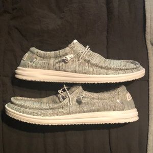 I am selling an grayish and white pair of Hey Dudes. Size 12.